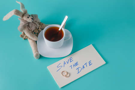 Cute rabbit doll with text message and cp of coffeeの写真素材