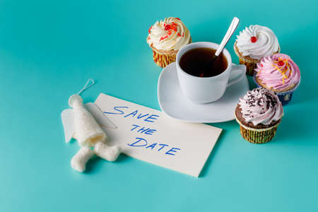 Felt angel with message save the date on aquamarine backgroundの写真素材