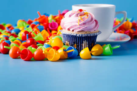 Kid breakfast concept. Colored mosaic and cupcake with teaの写真素材