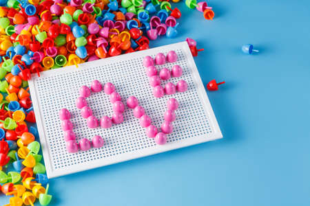 declaration of love concept. Kid plastic mosaic with word loveの写真素材