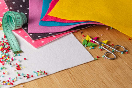 Invitation text banner with leisure needlework symbol. Colored wool feltの写真素材