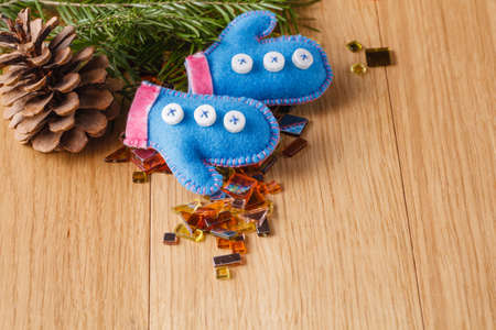christmas decoration on wood table. Pine and felted small doll clothesの写真素材