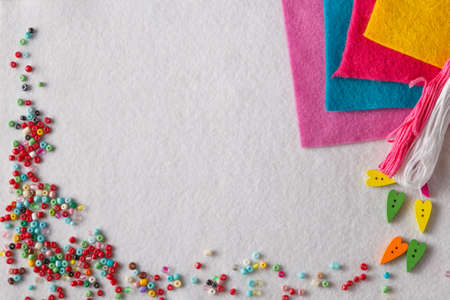Invitation text banner with leisure needlework symbol. Colored wool feltの写真素材