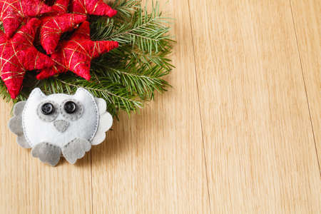 New year decoration concept. Flat felt owl and christmas treeの写真素材