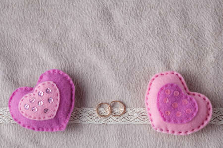 Wedding card decoration with couple rings and hearts