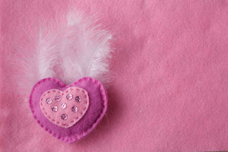 soft handmade felt background with heartの写真素材