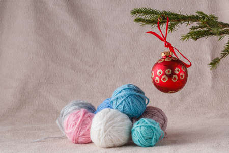Heap of wool clew on soft background with christmas decorationの写真素材