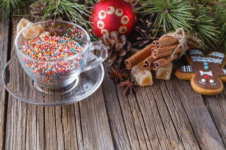 xmas table decoration. Rustic wooden table with spice and cup