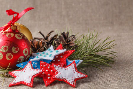 Christmas ornament. Green pine on coarse wovenの写真素材