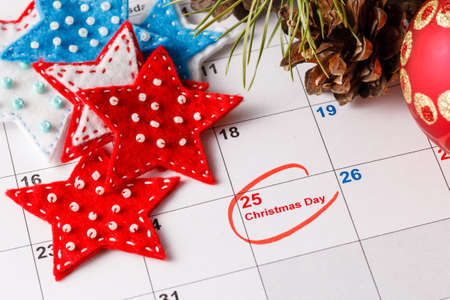 Coming xmas day. Highlighting christmas date on calendarの写真素材