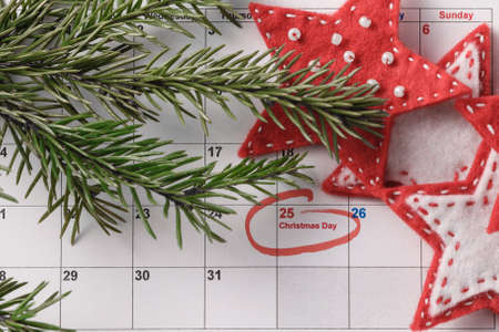 Coming xmas day. Highlighting christmas date on calendarの写真素材