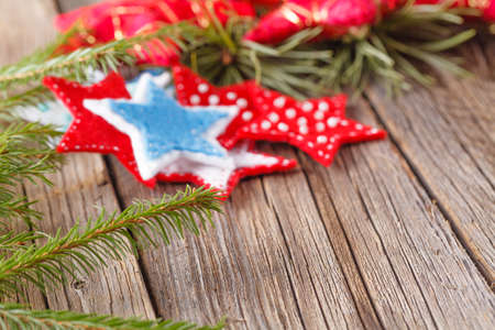 Christmas design concept. Handmade felt figures on rustic wooden tableの写真素材