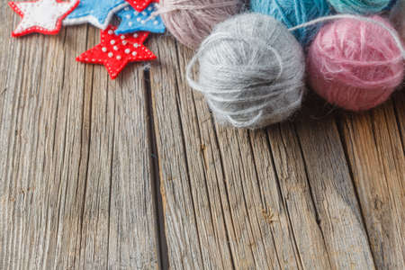 Hobby needlework background concept. Colored wool balls on tableの写真素材