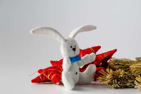 Hobby needlework concept. Handmade felt toy bunny with colored wool clewの写真素材