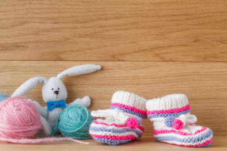 Newborn booties for christening or birthday invitation announcementの写真素材