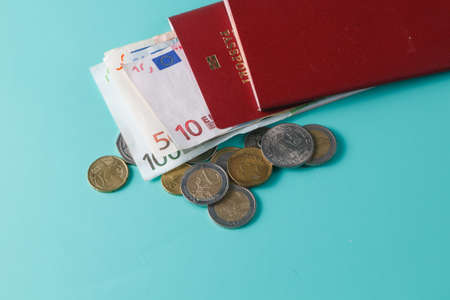 Passport with banknotes and coins. Closeup viewの写真素材