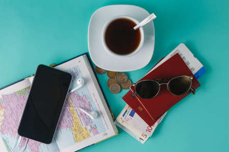 Travel planing for couple. Open map with passport an moneyの写真素材