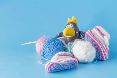 Hobby leisure concept. Funny crow with colored wool clewの写真素材