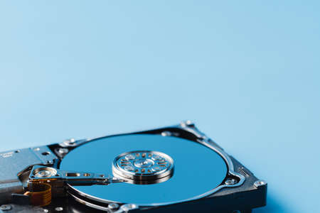 Data repair concept. Open HDD on plain blue backgroundの写真素材