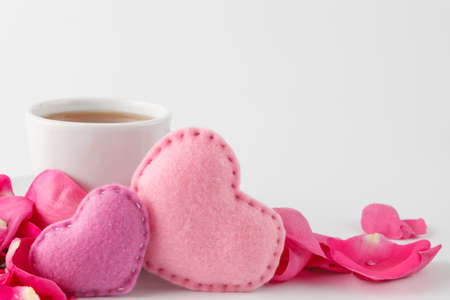 Valentines day concept. Two soft handmade heart with rose petalsの写真素材