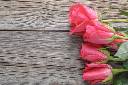 Valentine day gift. Roses bouquet on rustic wooden tableの写真素材