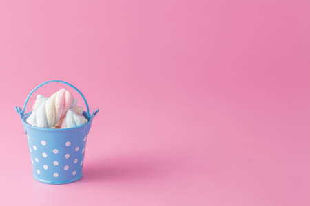 Birthday party invitation. Group of twisted marshmallow in bucket