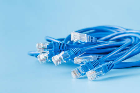 blue computer ethernet cables on blue background