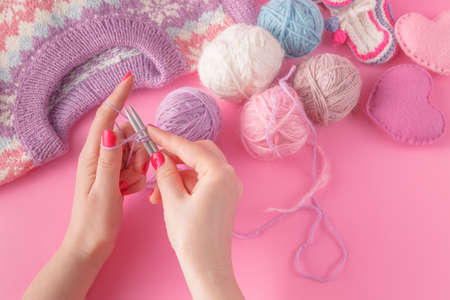 knitting leisure concept. Womans hands with yarn ball and stringsの写真素材