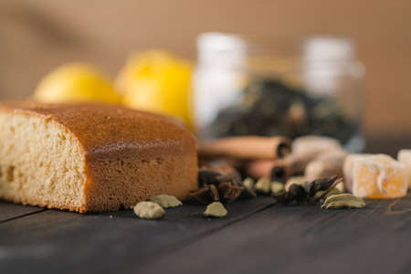 Spices cake on rustic table. Closeup view