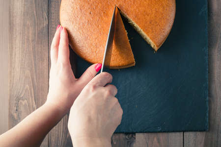 Woman hands cutting manna pie. Business daigram concept