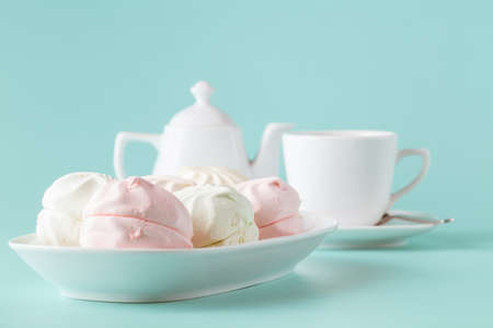 pastel colors pink and white marshmallows on a white plateの写真素材