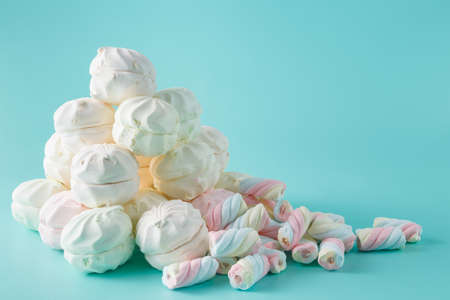 Colorful marshmallow heap on aquamarine backgroundの写真素材
