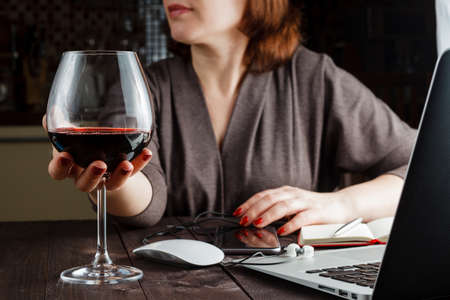 beautiful woman with glass red wineの写真素材