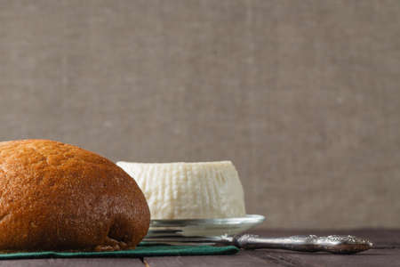 Fresh white cheese and bread.の写真素材