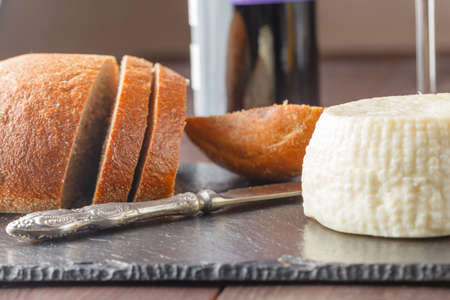 Bread, cheese and red wine.の写真素材