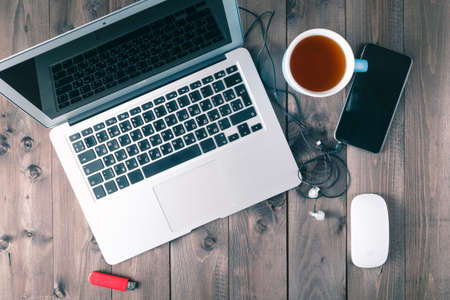 laptop on wooden tableの写真素材