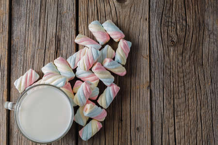 Twisted colored marshmallow with milkの写真素材
