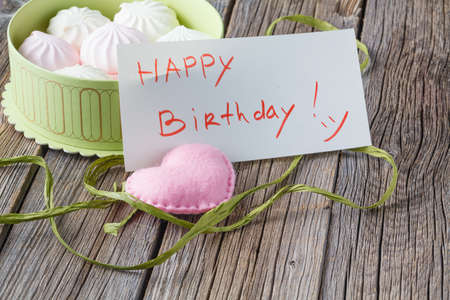 Gift box with homemade marshmalow, Happy birthday message on noteの写真素材