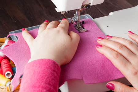 Tailor working on a sewing machineの写真素材