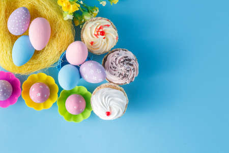 decoration with easter eggs nest on blue background