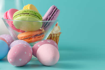 Easter breakfast with milk and french macaroon, closeup view
