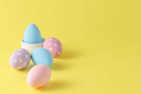 Eastern eggs on yellow paper background, pasterl colorの写真素材