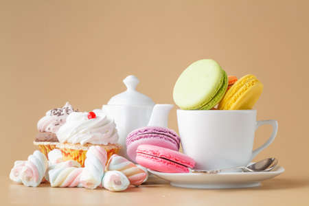 French delicious dessert macaroons and twisted marshmallow on tableの写真素材
