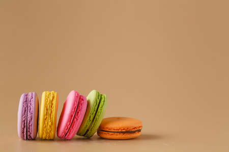 Five Colorful macaroons on beigeの写真素材