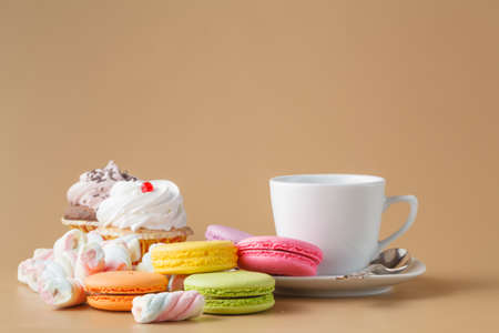 French delicious dessert macaroons and twisted marshmallow on tableの写真素材