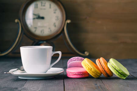 French colorful macarons with cup of teaの写真素材