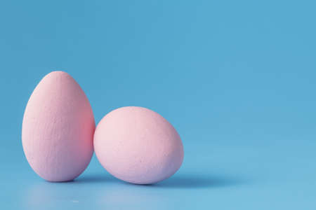 Colored easter eggs on blue backgroundの写真素材