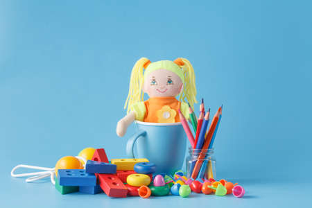 Colorful Toys Collection with doll on blueの写真素材