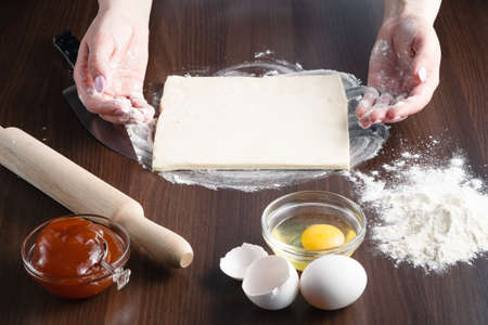 Housewife laid out on his kitchen table, the ingredients for making croissantの写真素材