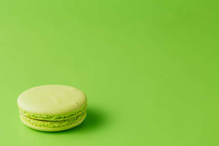 One macaroon on green backgroundの写真素材